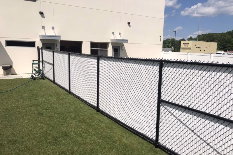 Chain Link Fence with White Slats at Dog Kennel